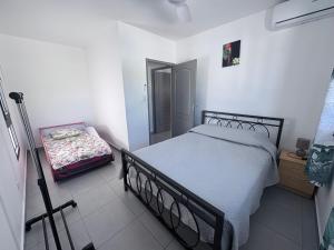 Postel nebo postele na pokoji v ubytování Ti case muguets