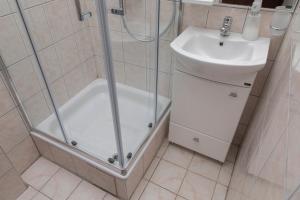 a bathroom with a shower and a sink at Vila Midami - Herceg Novi Savina in Herceg-Novi