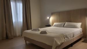 Posteľ alebo postele v izbe v ubytovaní CASA MILA SV guesthouse