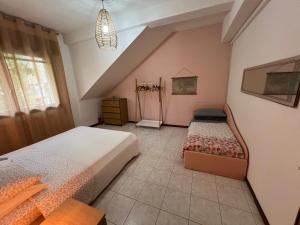 Ένα ή περισσότερα κρεβάτια σε δωμάτιο στο Venice Villa Rodio