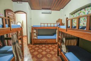 Postel nebo postele na pokoji v ubytování Hostel Roraima