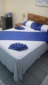 Postel nebo postele na pokoji v ubytování The Grand Begonia Beach Hotel