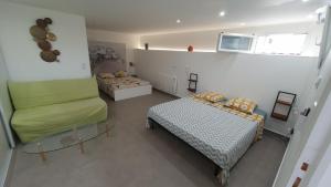 Ένα ή περισσότερα κρεβάτια σε δωμάτιο στο APPART DANS VILLA AVEC GRANDE TERRASSE PRIVATIVe