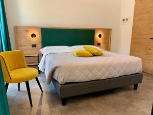 Postel nebo postele na pokoji v ubytování Hotel Locanda Alla Perla