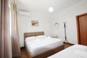 Postel nebo postele na pokoji v ubytování Villa Reve de Tirana