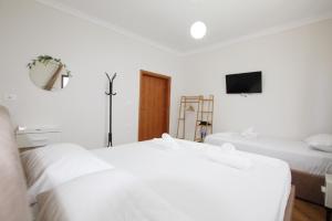 Postel nebo postele na pokoji v ubytování Villa Reve de Tirana