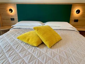 Postel nebo postele na pokoji v ubytování Hotel Locanda Alla Perla