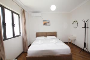 Postel nebo postele na pokoji v ubytování Villa Reve de Tirana