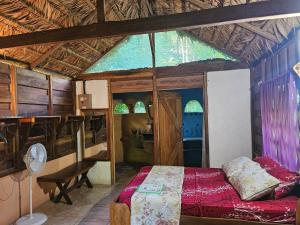 Postel nebo postele na pokoji v ubytování Wildlife Lodge Cahuita