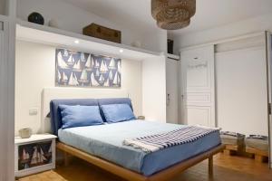A bed or beds in a room at Depandance in Villa Gisella