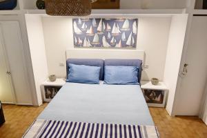 A bed or beds in a room at Depandance in Villa Gisella