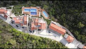 an aerial view of a house on a hill at Adria Mare one bedroom apartment in Tušupi