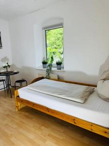 A bed or beds in a room at Fewo-Wilhering