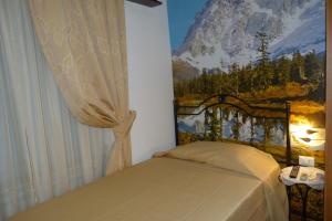 Postel nebo postele na pokoji v ubytování B&B Le Stagioni