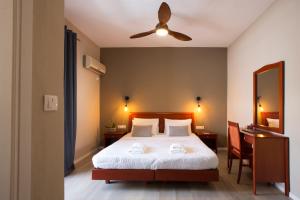 Postel nebo postele na pokoji v ubytování Hotel Kastri