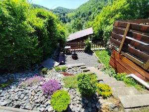 an aerial view of a garden with flowers and a fence at Chata Hulina in Moderštôlňa