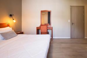 Postel nebo postele na pokoji v ubytování Hotel Kastri
