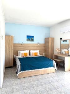 Postel nebo postele na pokoji v ubytování Sotirakis Hotel