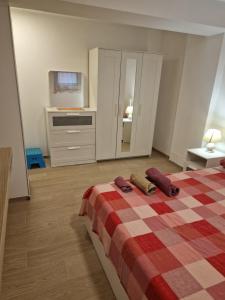 Ένα ή περισσότερα κρεβάτια σε δωμάτιο στο Casa dell'ape Maia