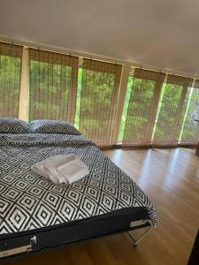a bedroom with a bed with a pillow on it at Easy Stay Apartments in Rīga