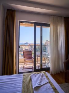 Postel nebo postele na pokoji v ubytování Hotel Petrovac