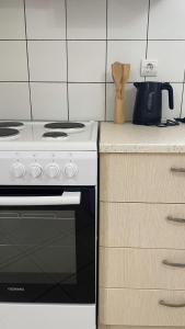 a kitchen with a stove and a counter top at Apartment for Relaxed Holidays 4 in Kriezá