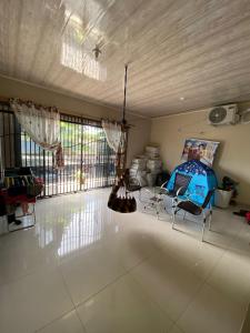 a large living room with a table and chairs at Casa cop 30 in Belém +9 photos