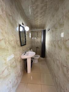 a bathroom with a sink and a toilet at Nour D'asilah 3 in Asilah