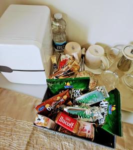 a pile of chips and snacks on a table next to a toaster at Enniscrone Guest Rooms in Enniscrone