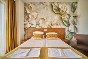Postel nebo postele na pokoji v ubytování Hotel Petrovac