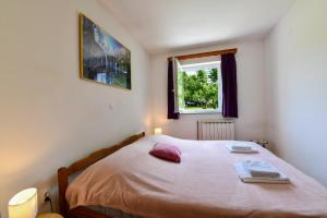 Postel nebo postele na pokoji v ubytování Apartman Babara