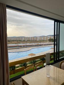 a view of a pool from a hotel room window at Monte Cabo in Cabo Negro