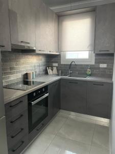 Η κουζίνα ή μικρή κουζίνα στο Modern & Charming