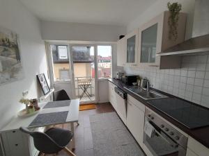 a kitchen with a sink and a counter top at Freiraum in Schweinfurt