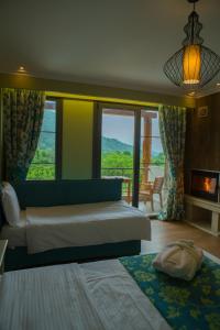 A bed or beds in a room at Irene's Resort