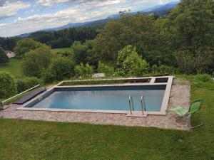 an overhead view of a swimming pool in a yard at Sunny Karla apartment Dramlje in Dramlje