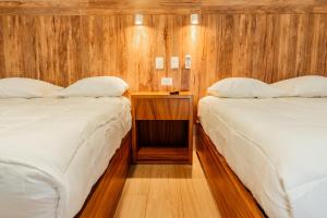 Postel nebo postele na pokoji v ubytování Xoza Hotel Urban Escape