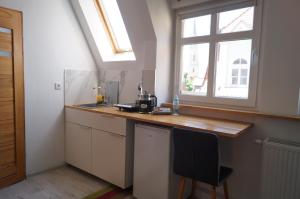 Η κουζίνα ή μικρή κουζίνα στο Twój mały Apartament