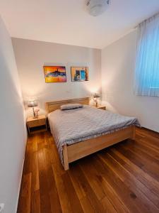 Postel nebo postele na pokoji v ubytování Apartment Aleks