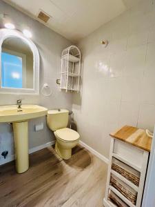 a bathroom with a toilet and a sink at Calas Font Nova-BookApartments in Peñíscola