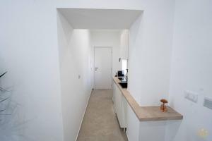 Η κουζίνα ή μικρή κουζίνα στο Nymphē Ortigia Apartments +50 φωτογραφίες