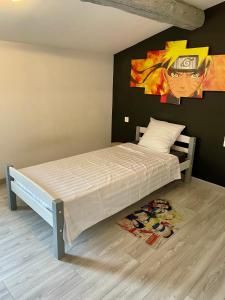 Ένα ή περισσότερα κρεβάτια σε δωμάτιο στο Maison de village proche mer