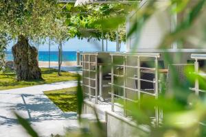 a view of the beach from the side of a building at Opalium Beach Front Suites in Potos