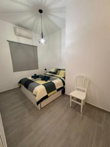 Łóżko lub łóżka w pokoju w obiekcie CASA CALAMICHE