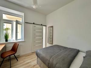 Ένα ή περισσότερα κρεβάτια σε δωμάτιο στο Like-a House Stare Miasto