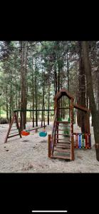 a group of playground equipment in a park at Bamboo beach in Ts'ikhisdziri