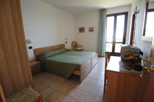 A bed or beds in a room at Hotel San Remo