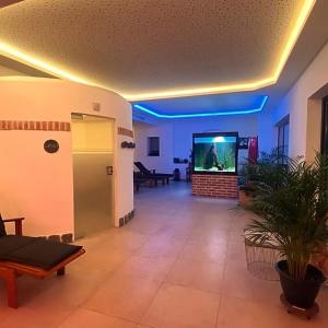 a large living room with a large screen tv at Gasthof Zur Post Thurmansbang in Thurmansbang