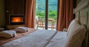 A bed or beds in a room at Irene's Resort