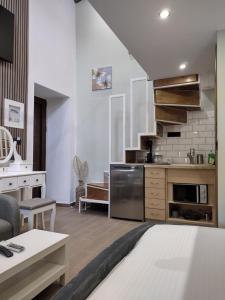 a living room with a kitchen and a dining room at Stefanos Maisonette in Parga